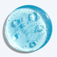A translucent light-blue gel puddle with small air bubbles, exhibiting a glossy, slightly textured surface against a white backdrop, casting a subtle shadow