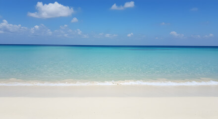 Obraz premium Crystal Clear Turquoise Ocean Water and Sandy Beach Under a Bright Blue Sky with Scattered Clouds
