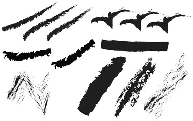 Collection of black grunge brush strokes on a white background for design use