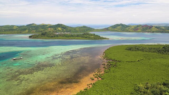 Scenic Cinematic aerial drone video of Siargao island with East Bucas Island and Bancuyo Island, Dapa, Surigao den Norte, Mindanao, Philippines