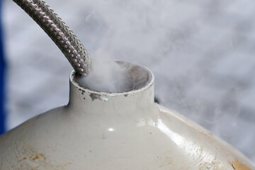 Cold vapor cryogenic hose metal container white tank frost laboratory safety industrial liquid nitrogen gas
