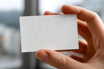 Hand Holding Textured Paper Business Card Mockup