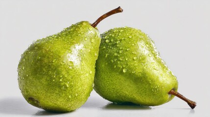 Two fresh green pears with water droplets
