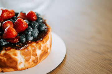 Delicious dessert featuring fresh strawberries and blueberries on a creamy base