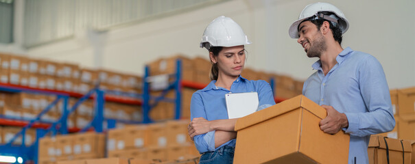 Warehouse worker working in warehouse storage. Foreman or worker work at factory site check up products in site. Inventory worker working in  factory Storehouse