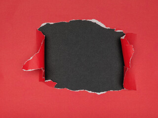 Red Paper Torn Revealing Black Background