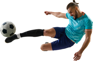 Aggressive soccer player striking ball in sliding motion with power on transparent background. Concept of determination, strength, passion, competition, sports energy and athletic emotion.