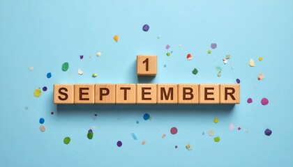 Naklejka premium Wooden Blocks with Date 1 September. Calendar for birthday or anniversary on solid colored background with confetti