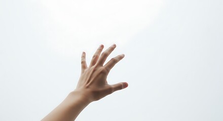 hand reaching towards the sky