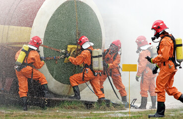 Firefighters practice emergency response techniques on a simulated training exercise at a safety...