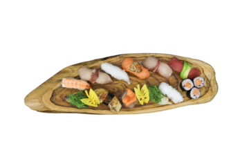 Exquisite Sushi Platter: An artfully arranged assortment of delectable sushi pieces on an elegant wooden serving platter, a gastronomic delight for food lovers.