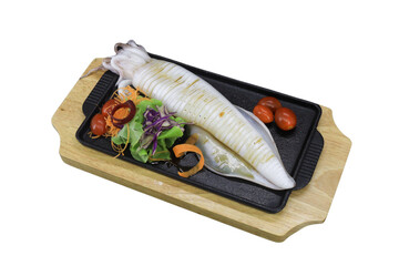 Fresh Seafood Delight: A tantalizing presentation of a freshly prepared squid, artfully arranged alongside vibrant vegetable garnishes on a wooden serving board. A culinary portrait of freshness.