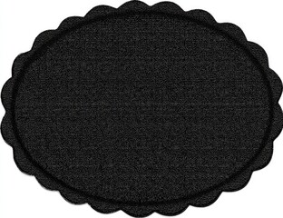Oval black textured rug with scalloped edge