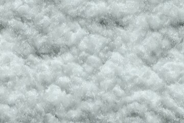 Obraz premium Close-up view of frothy, light gray water