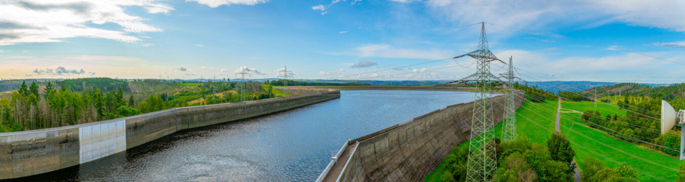 Aerial view of the Hohenwarte Dam (Hohenwarte Reservoir) and the associated pumped storage facility in Thuringia, Germany. The curved concrete gravity dam rises about 75 meters.