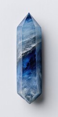 Double-terminated blue crystal with internal swirling patterns, displayed on a white background