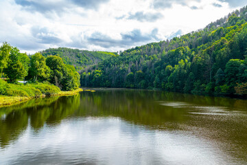 Aerial view of the Hohenwarte Dam (Hohenwarte Reservoir) and the associated pumped storage facility in Thuringia, Germany. The curved concrete gravity dam rises about 75 meters.