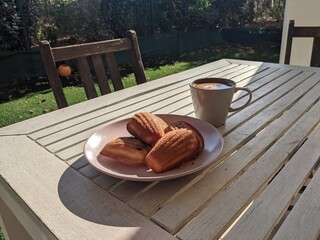 Coffee and madeleines on the terrace in France