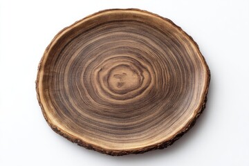 A rustic, circular wooden platter, showcasing rich brown wood grain and natural tree rings, sits on a stark white background.  The edges retain a rough, slightly uneven texture