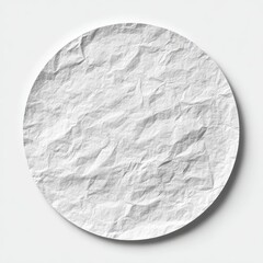 A round, white, crumpled paper plate