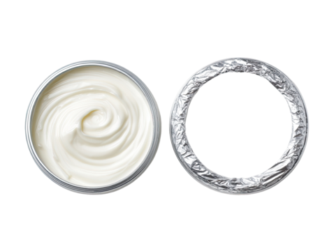 Creamy substance in a metal container with foil lid
