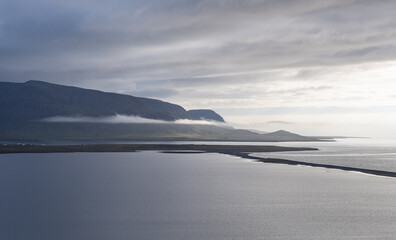 island, shore and rocks on the seashore in iceland
