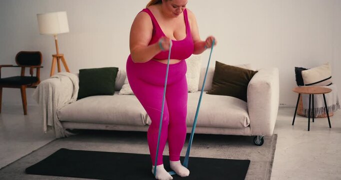 Overweight Plus Size Woman does strength training with resistance band