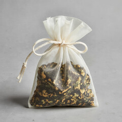Herbal linen pouch with dried flowers and aromatic botanicals on neutral background. Ideal for aromatherapy, eco packaging, wellness, and natural product visuals. AI generated.
