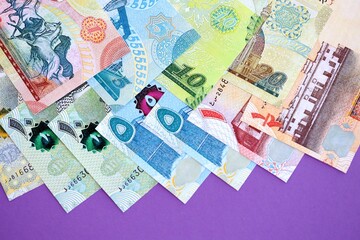 Bahraini dinar money bills in big amount on purple. Finance and banking concept