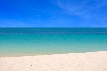 Nature of the ocean and blue sky Summer with sunshine, sandy beaches, clear blue waters sparkling against the blue sky. on an island with good ecology and environment Background for summer vacation