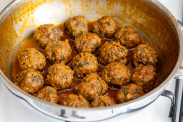 Close-Up of Spanish Albóndigas in Tomato Sauce Cooked in a Skillet
