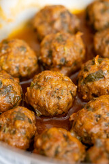 Close-Up of Spanish Albóndigas in Tomato Sauce Cooked in a Skillet

