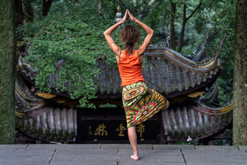 practicing yoga-tai chi fusion at Fuju Temple, Emeishan, Leshan Prefecture, Sichuan, People's Republic of China, Asia