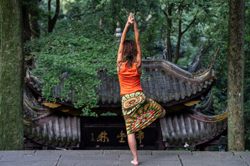 practicing yoga-tai chi fusion at Fuju Temple, Emeishan, Leshan Prefecture, Sichuan, People's Republic of China, Asia