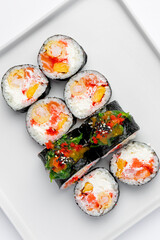 Sushi roll with salmon and caviar close up macro isolated
