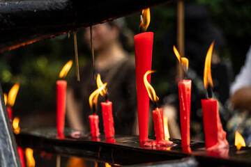 lit votive candles, Wannian temple ('Temple of the ten thousand years'), Emeishan, Leshan Prefecture, Sichuan, People's Republic of China, Asia