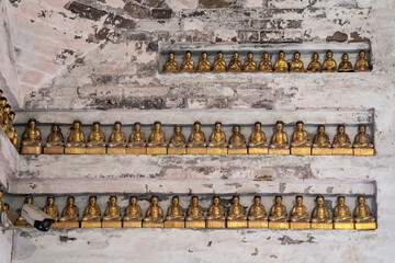 Buddhas on some shelves, Brick hall without beams, built in 1600, Wannian temple ('Temple of the ten thousand years'), Emeishan, Leshan Prefecture, Sichuan, People's Republic of China, Asia