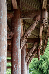 Chudian Palace monastery, porch with wooden columns, Emeishan, Leshan Prefecture, Sichuan, People's Republic of China, Asia