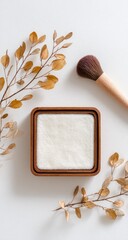 Creamy cosmetic product in a wooden box,  surrounded by dried leaves and a makeup brush.  Natural beauty