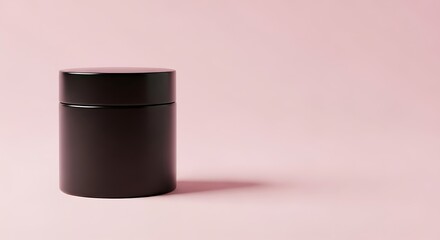 Black cosmetic jar on pink background, minimal beauty product packaging