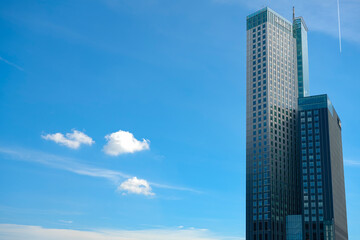 Fototapeta premium Modern Skyscraper in Rotterdam Against Blue Sky