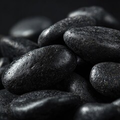 Close-up of dark, smooth stones