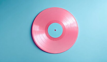 A vibrant pink vinyl record sits on a light teal background