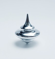 Fototapeta premium Polished chrome spinning top, smooth reflective surface