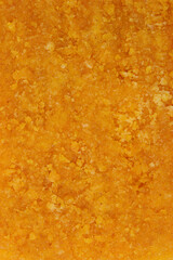 A detailed macro shot of the crispy, textured surface of a breaded cheese cutlet, showing the golden-brown breading