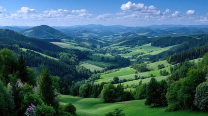 Obraz premium Lush Green Rolling Hills Valley Landscape with Blue Skies and Clouds Forest Trees Idyllic Countryside Scenic Vista Nature Scenery in Bright Sunlight