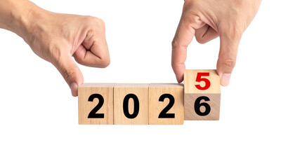 Hand holding wooden word blocks to spell out digit 5 to 6  for a new year 2025 to 2026 on PNG white background.