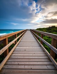 Fototapeta premium Wooden boardwalk leading to ocean (1)