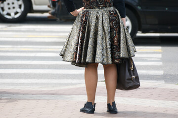 pedestrians are waiting for a signal to cross the road