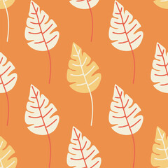 Bright seamless leaf pattern on orange background